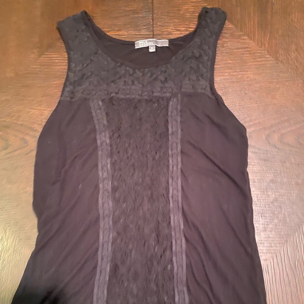Black no sleeve lace front shirt.